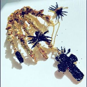 Artisan 1 of Golden Encrusted skeletal remains hand chain web spiders &crucifix.